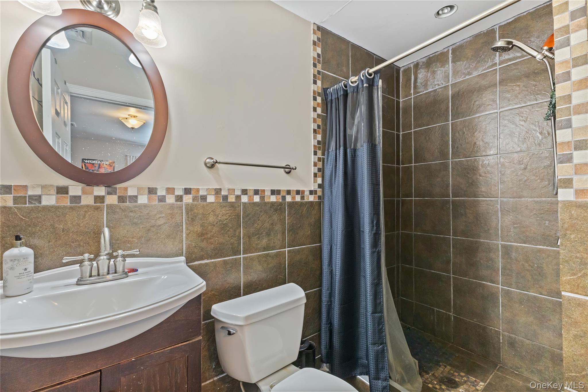 10 Helin Road Hopewell Junction, NY 12533 - Photo 27 of 35 Full bath with a shower stall, vanity, tile walls