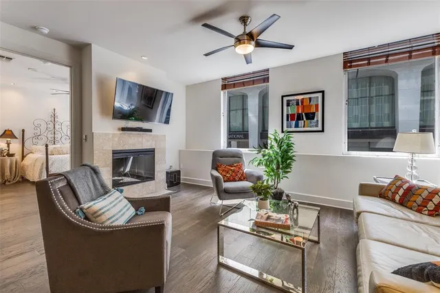 a living room with furniture fireplace and a flat screen tv