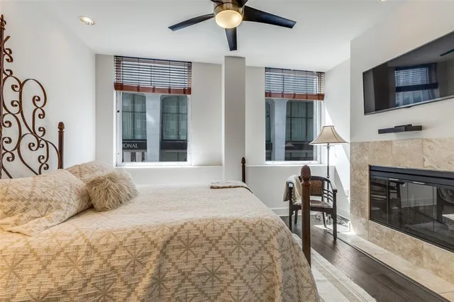 a bedroom with a bed and a television