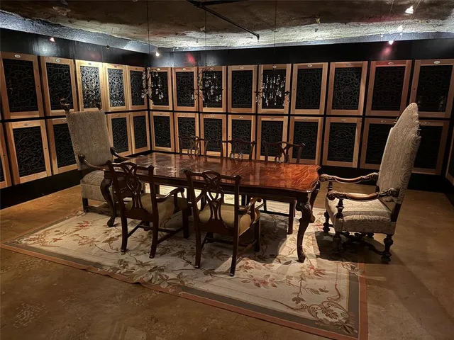 a media room with lots of chairs and a projector