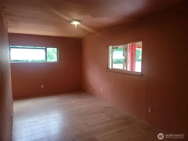 an empty room with windows
