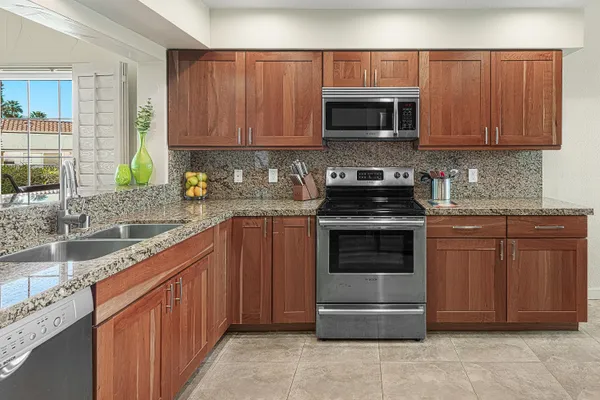 a kitchen with a sink and a microwave