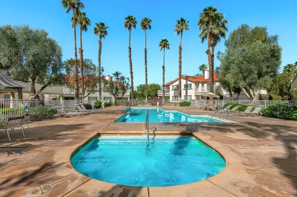 a view of a swimming pool with a yard