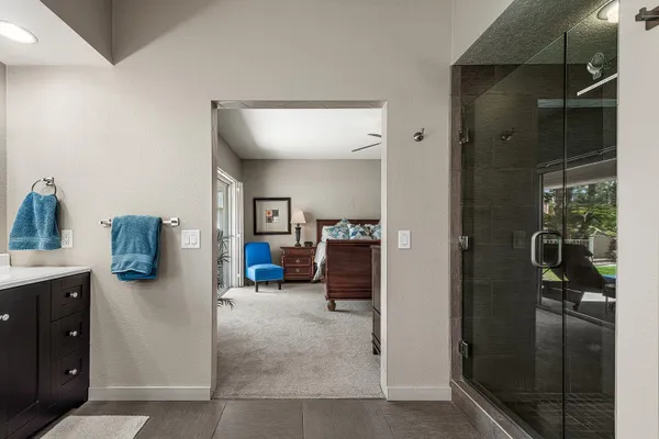 a view of a hallway and a livingroom with furniture