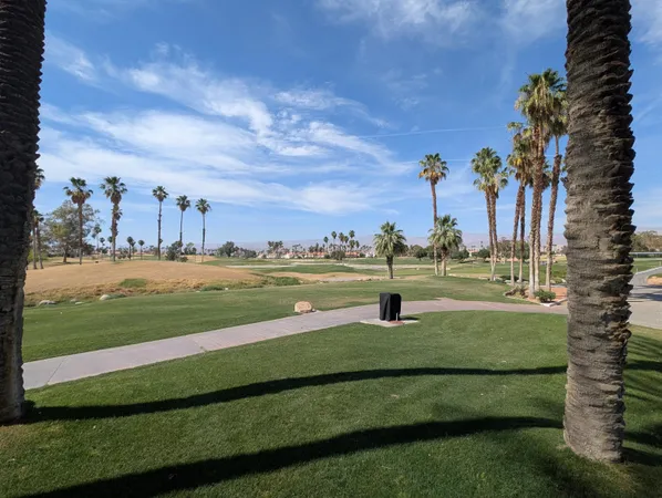 a view of a golf course with a lake