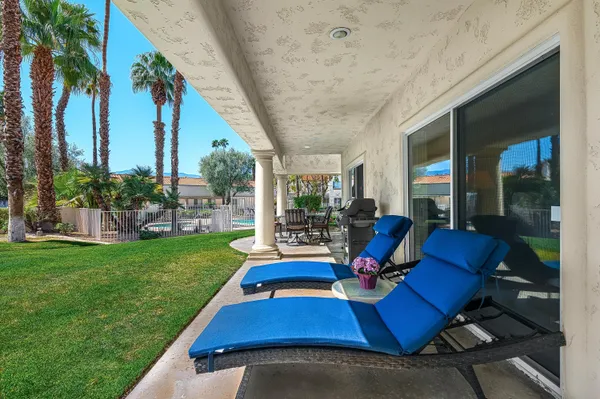 a view of swimming pool with outdoor seating