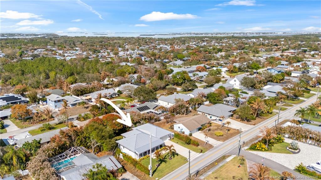 5169 Southeast Horseshoe Point Road Stuart, FL 34997 - Photo 40 of 54 an aerial view of residential building with parking