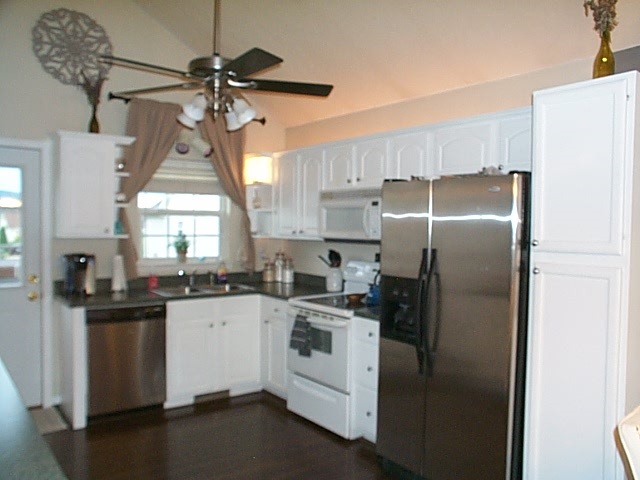 216 Rutledge Drive Waynesboro, VA 22980 - Photo 5 of 16 a kitchen with white cabinets and stainless steel appliances