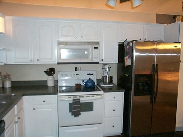 216 Rutledge Drive Waynesboro, VA 22980 - Photo 7 of 16 a kitchen with stainless steel appliances a refrigerator stove and cabinets