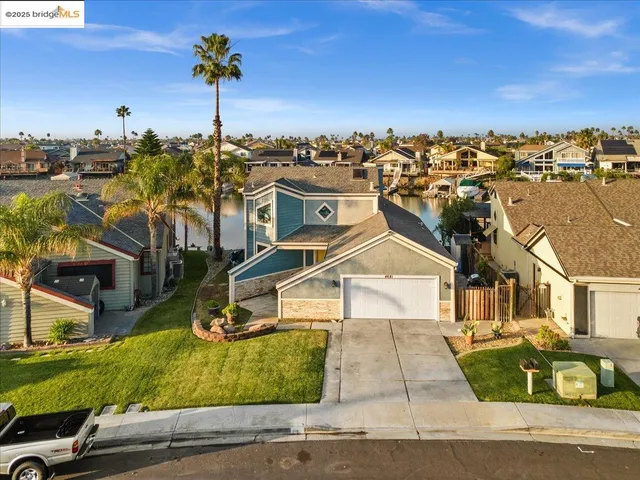an aerial view of residential houses with outdoor space