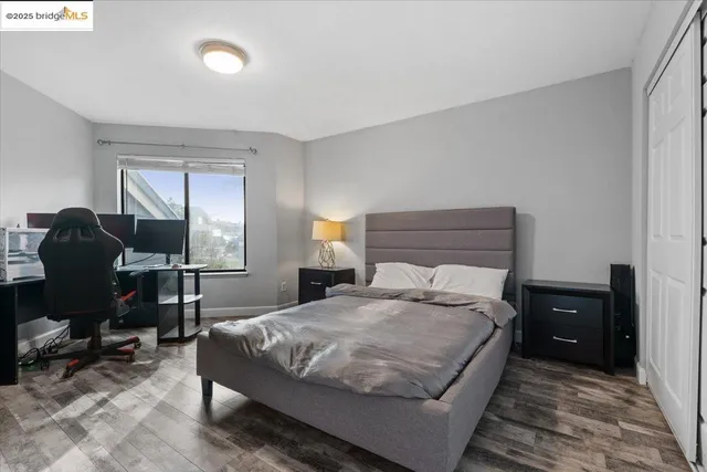 a bedroom with a bed and a lamp