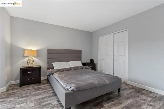 a view of entryway livingroom and hall with wooden floor