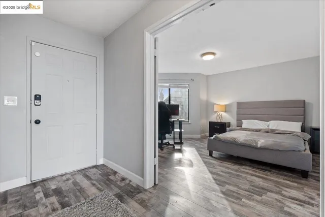 a bedroom with a bed and a couch