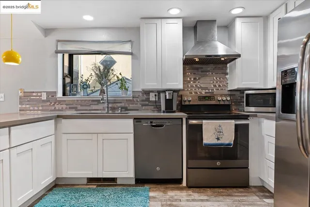 a bedroom with a bed a couch and dresser