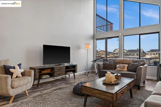 a living room with furniture and a book shelf