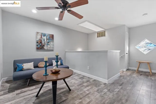 a bedroom with a bed a couch and dresser