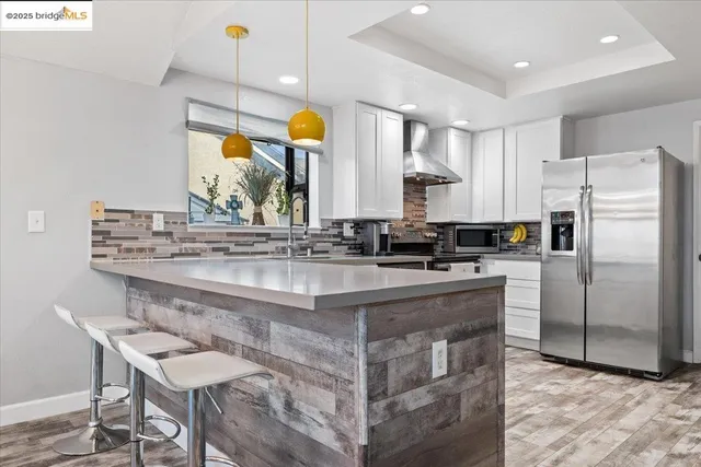 a kitchen with a sink cabinets and window