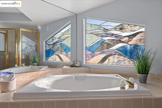 a bedroom with a bed and a view of kitchen