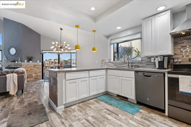 a kitchen with a sink cabinets and window