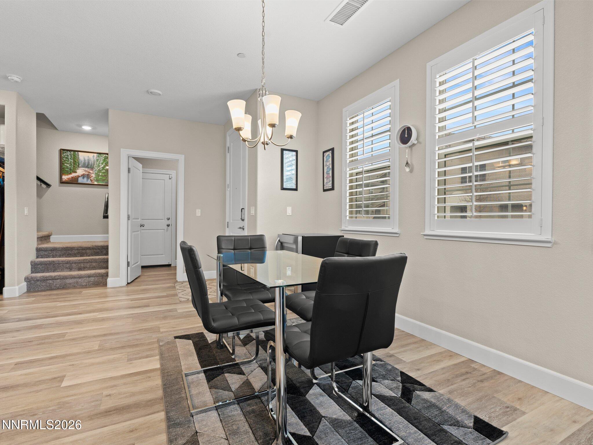 1914 Sea Horse Road, Unit C Reno, NV 89521 - Photo 12 of 28 a view of a dining room with furniture window and wooden floor
