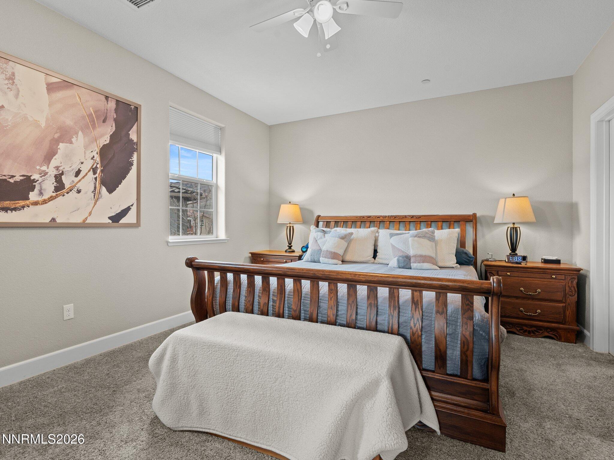 1914 Sea Horse Road, Unit C Reno, NV 89521 - Photo 15 of 28 a bed room with a bed and a painting on the wall