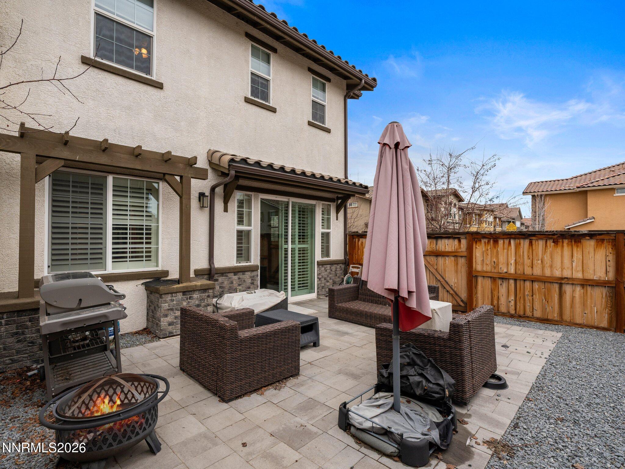 1914 Sea Horse Road, Unit C Reno, NV 89521 - Photo 25 of 28 a view of a patio with couches table and chairs with wooden fence