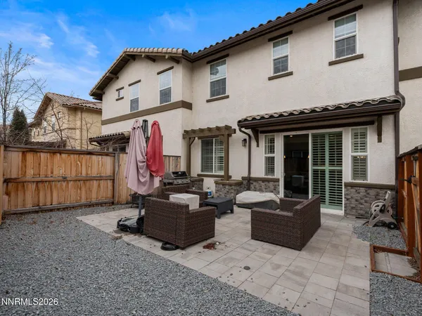 a view of the house with couches in front of it