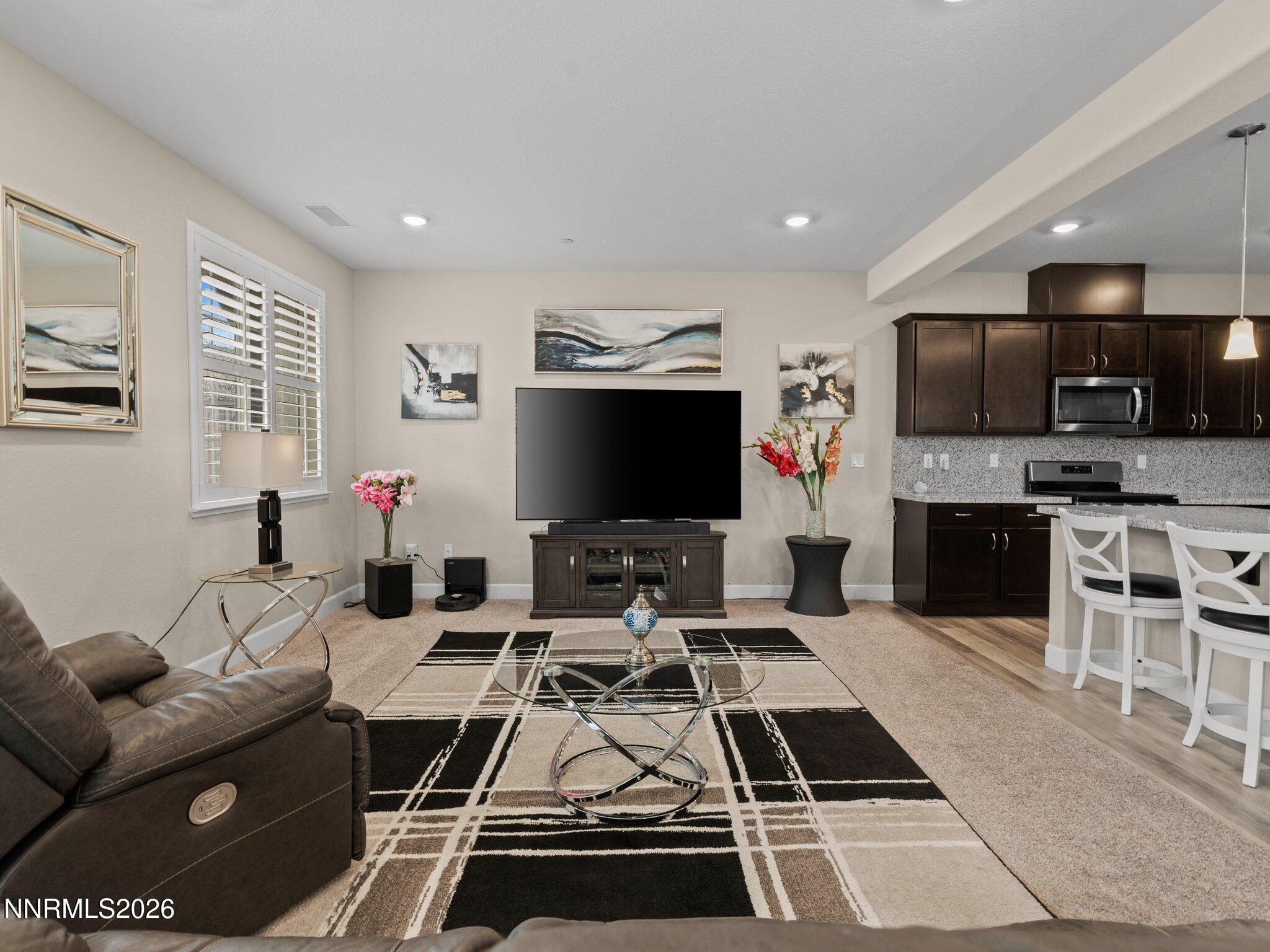 1914 Sea Horse Road, Unit C Reno, NV 89521 - Photo 5 of 28 a room with furniture a flat screen tv and kitchen view