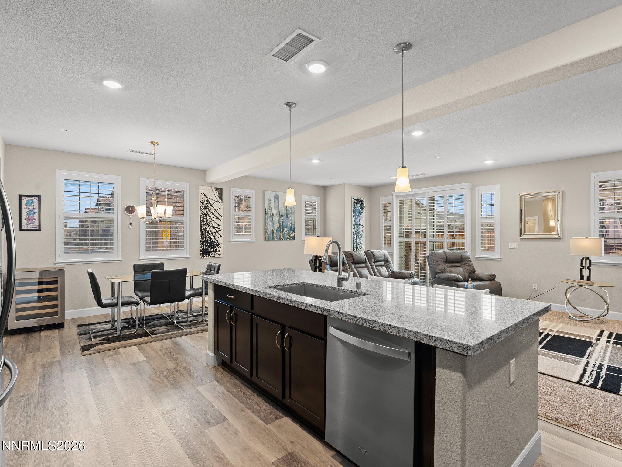 1914 Sea Horse Road, Unit C Reno, NV 89521 - Photo 8 of 28 a kitchen with sink stove and chairs
