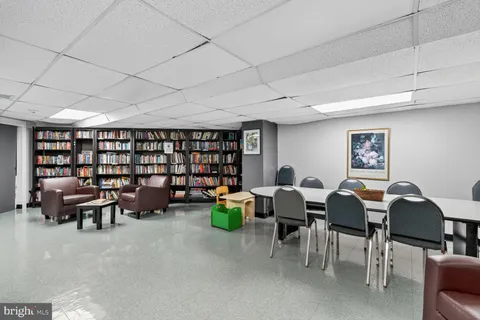a view of a living room and kitchen with a large window