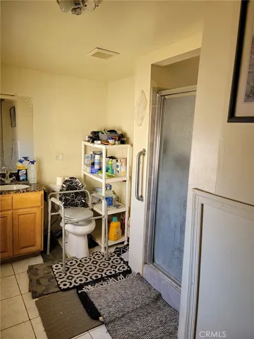 a bedroom with a bed and a mirror