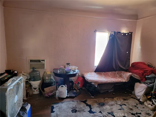 a room with furniture and musical instruments