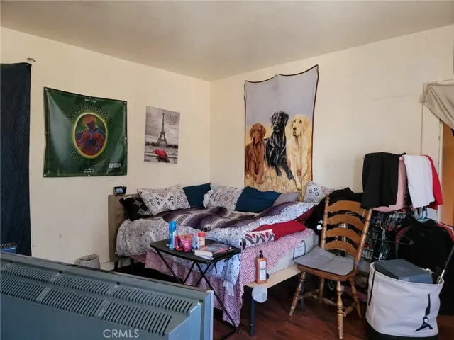 a bedroom with a bed and furniture