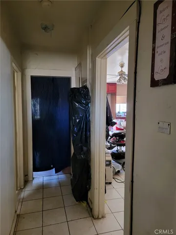 a bathroom with a toilet and a mirror