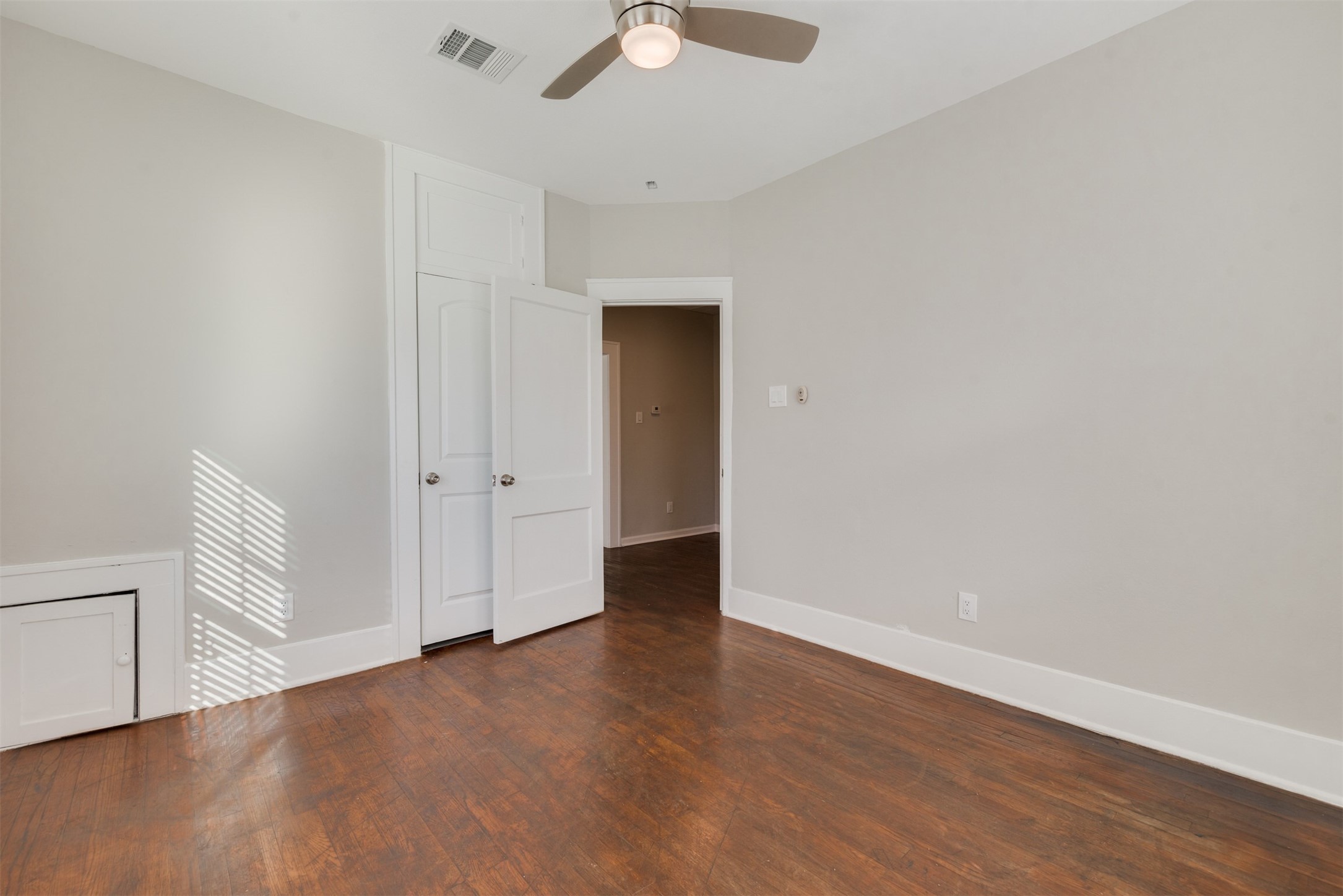 1219 West Gray Street, Unit 2 Houston, TX 77019 - Photo 14 of 25 a view of an empty room with wooden floor