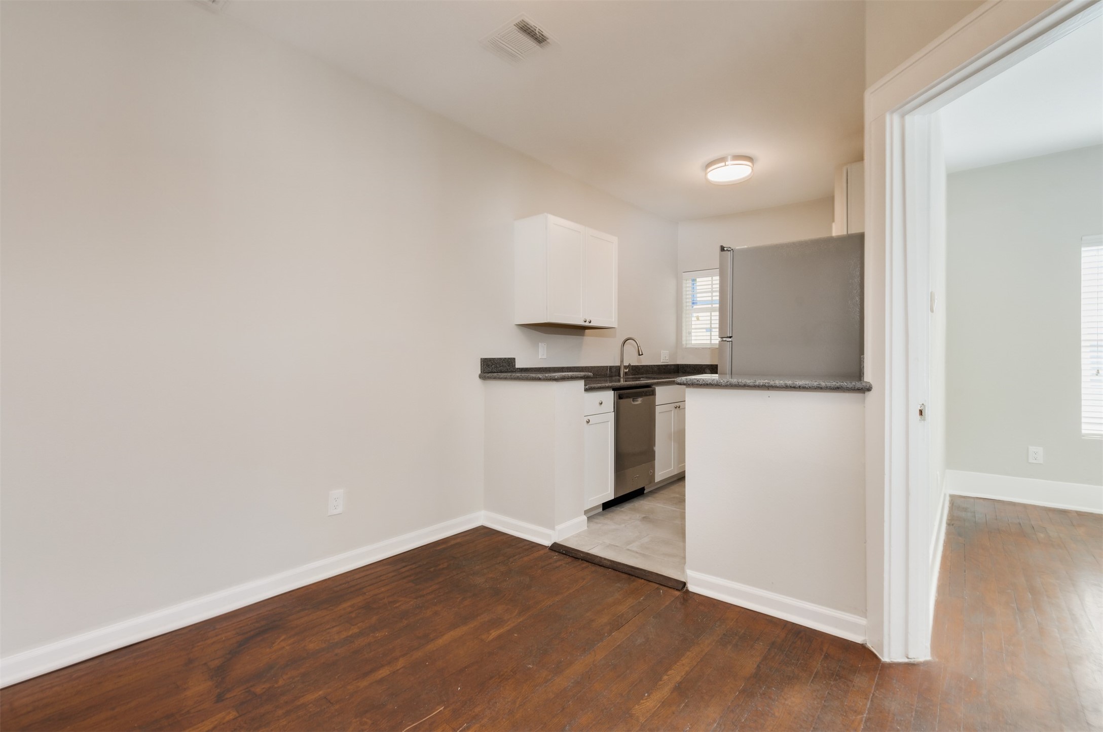 1219 West Gray Street, Unit 2 Houston, TX 77019 - Photo 15 of 25 a view of a kitchen with a sink and a refrigerator