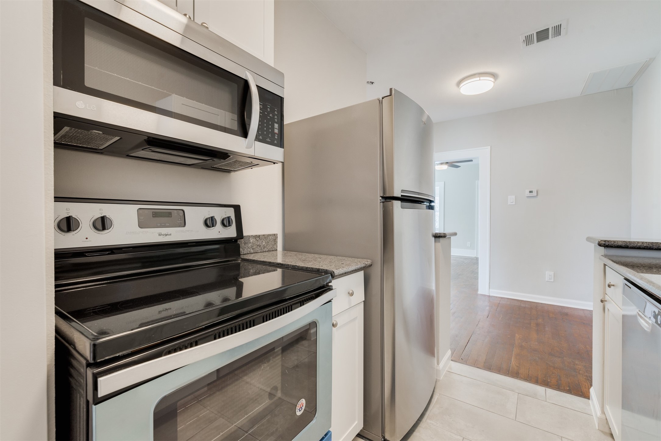 1219 West Gray Street, Unit 2 Houston, TX 77019 - Photo 19 of 25 a kitchen with a stove and a refrigerator