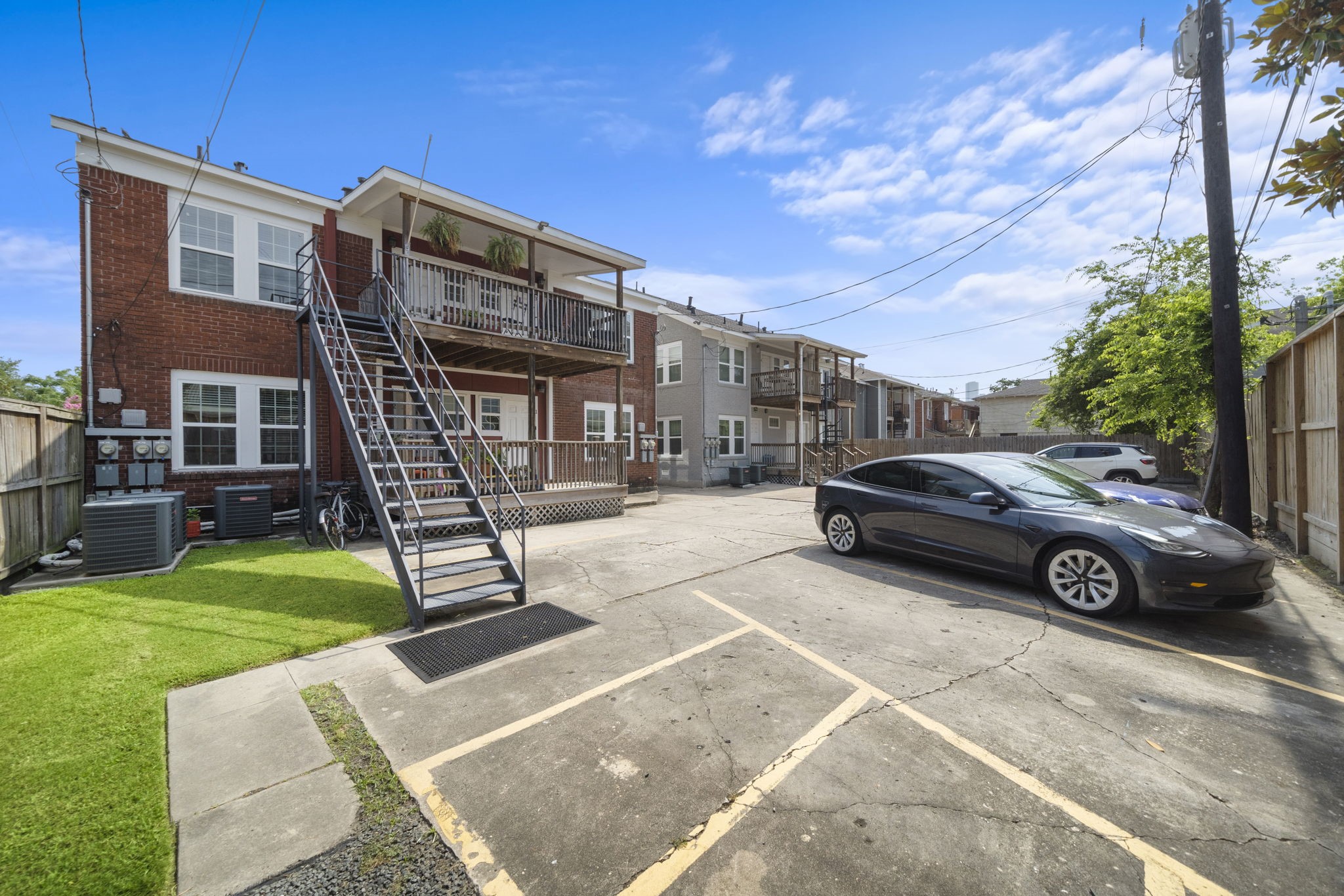 1219 West Gray Street, Unit 2 Houston, TX 77019 - Photo 24 of 25 a view of a car parked in front of a house