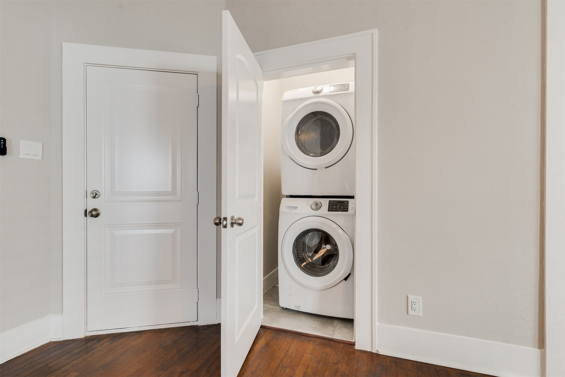 1219 West Gray Street, Unit 2 Houston, TX 77019 - Photo 4 of 25 a view of a hallway with washer and dryer