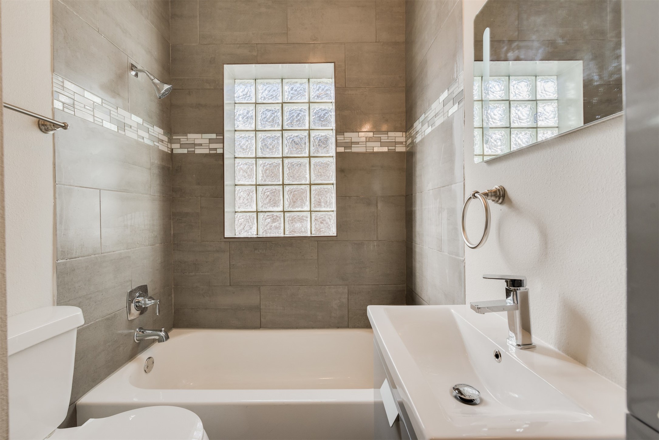 1219 West Gray Street, Unit 2 Houston, TX 77019 - Photo 8 of 25 a bathroom with a bathtub a shower and a sink