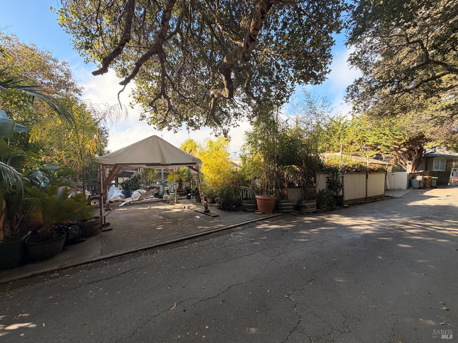 a couple of table and chairs under an umbrella