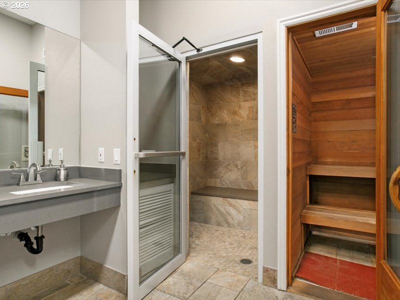 Southwest Cupola Place, Unit 132 South Beach, OR 97366 - Photo 17 of 28 a bathroom with a shower and a sink