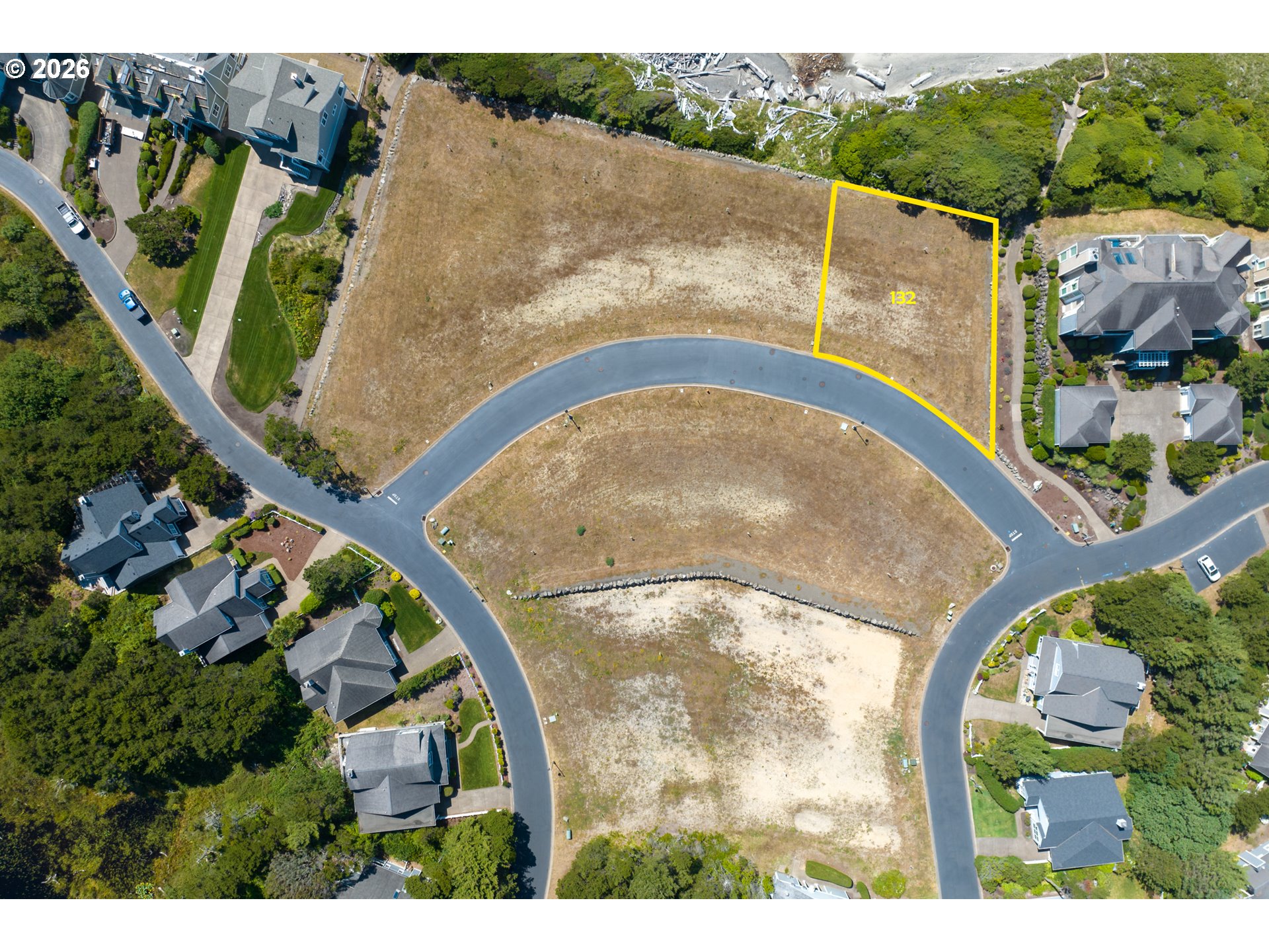 Southwest Cupola Place, Unit 132 South Beach, OR 97366 - Photo 2 of 28 an aerial view of a house a yard and a swimming pool