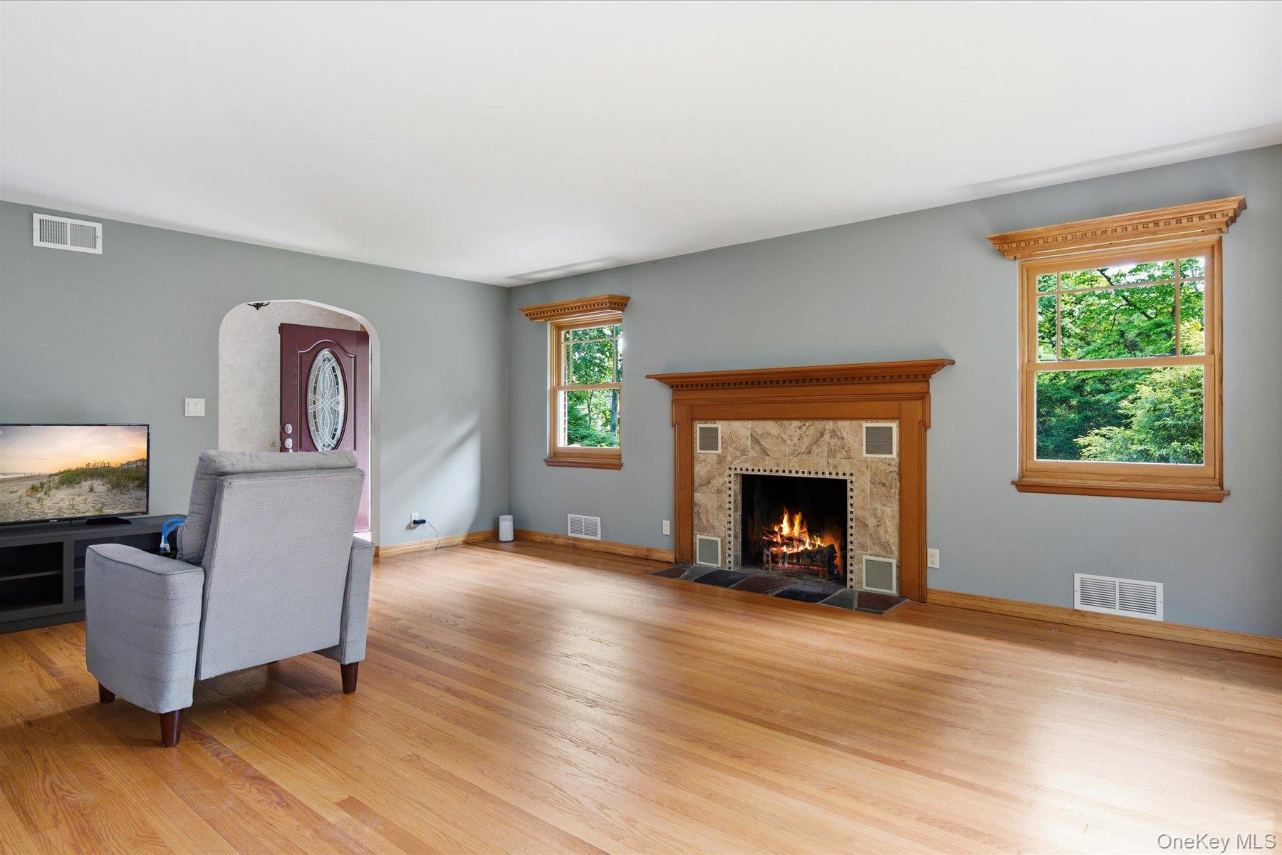 42 Cliff Road Port Jefferson, NY 11777 - Photo 5 of 22 a living room with furniture and a fireplace