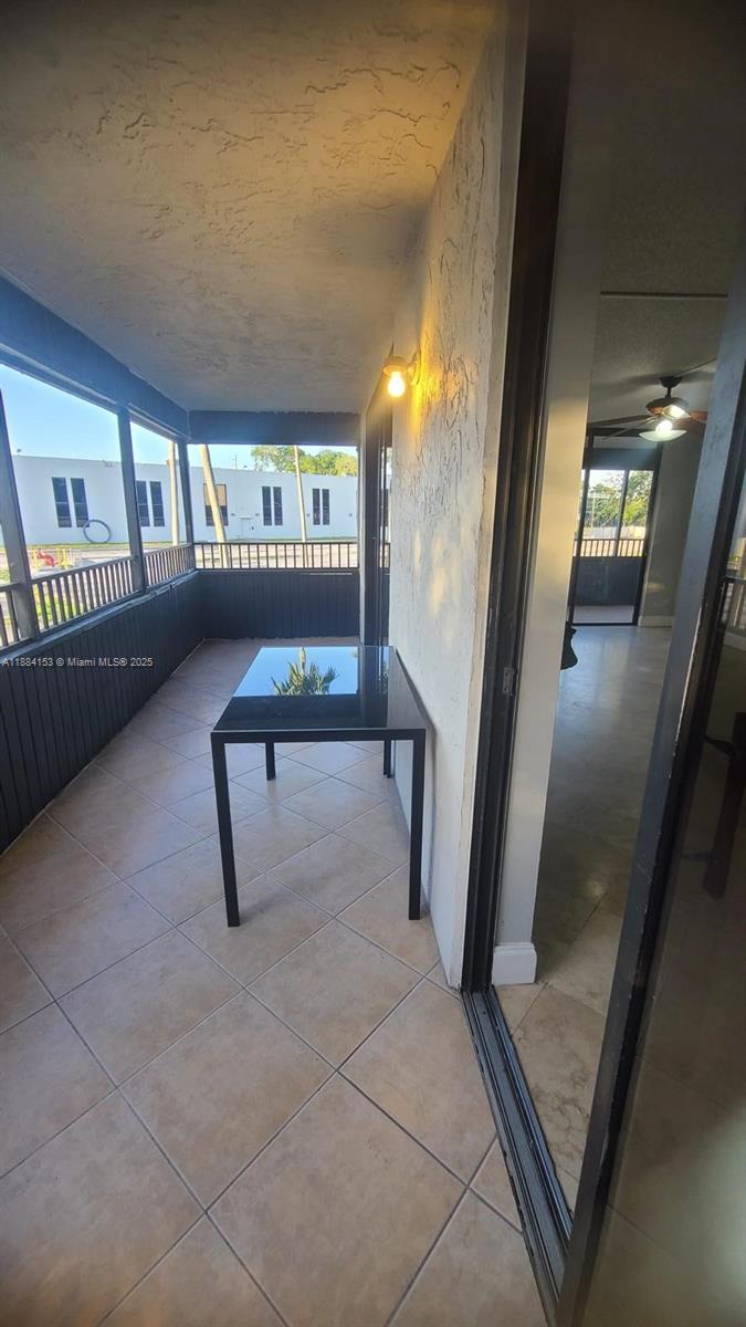 16220 Northwest 2nd Avenue, Unit 213 Miami, FL 33169 - Photo 13 of 22 a view of a livingroom with furniture and staircase
