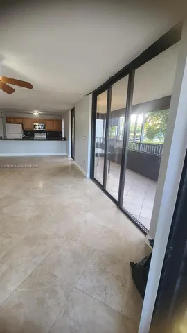 a view of empty room with large window