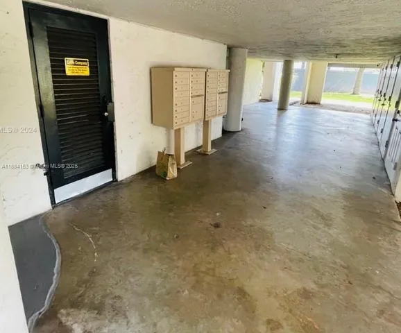 a view of an empty room with a fireplace