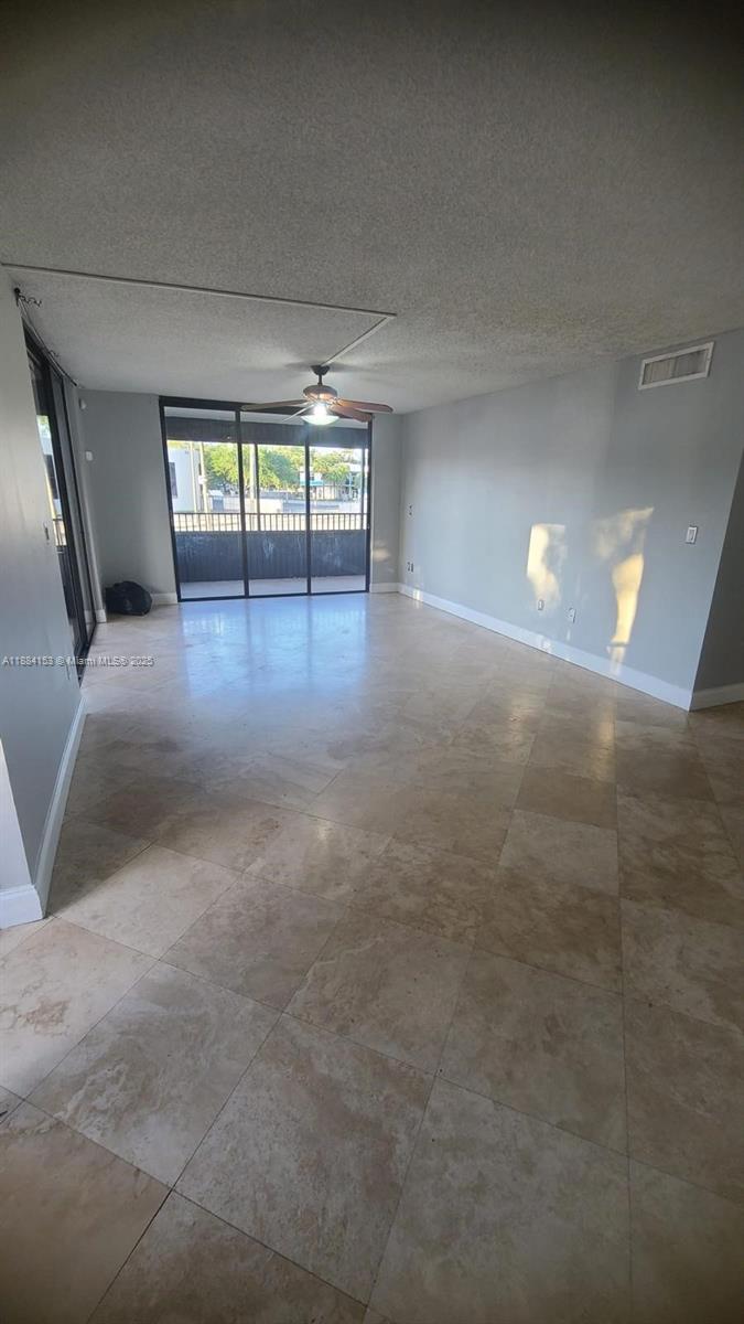 16220 Northwest 2nd Avenue, Unit 213 Miami, FL 33169 - Photo 6 of 22 a view of empty room with wooden floor