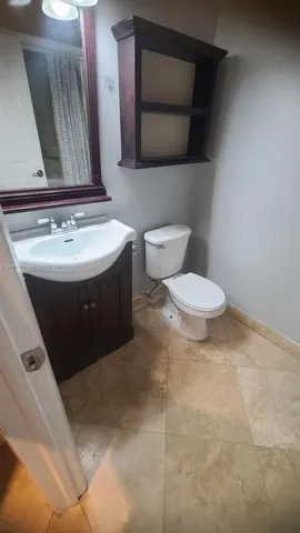 a bathroom with a toilet and a sink