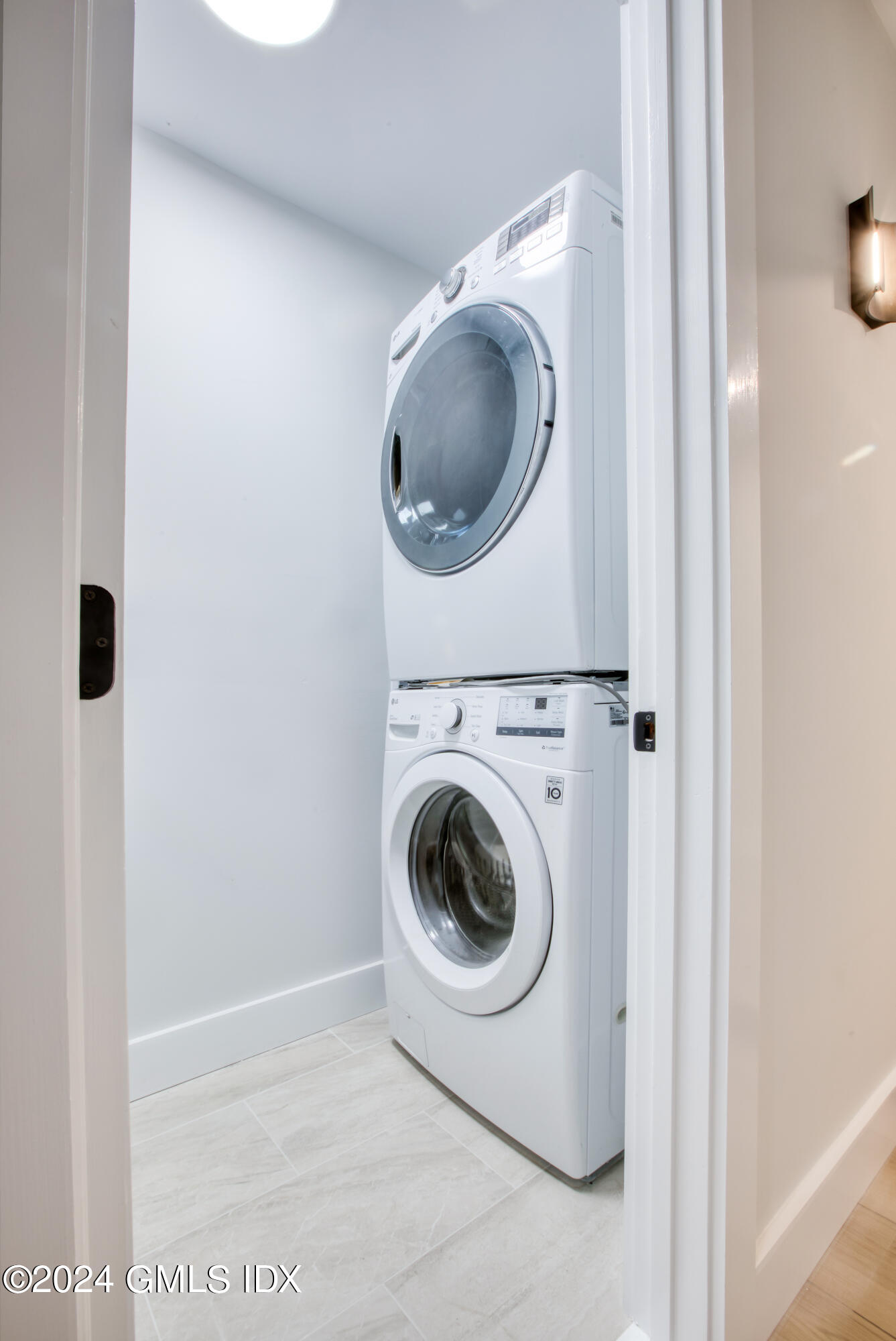 40 Prospect Street, Unit 1 Greenwich, CT 06830 - Photo 13 of 18 a utility room with dryer and washer